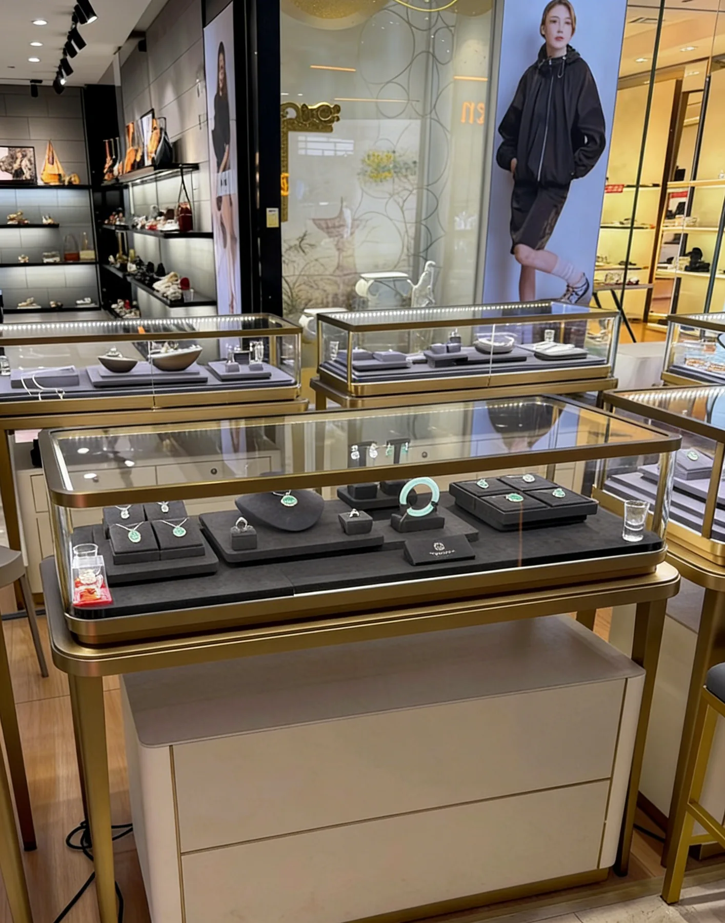 Gold stainless steel jewelry counter in a retail store